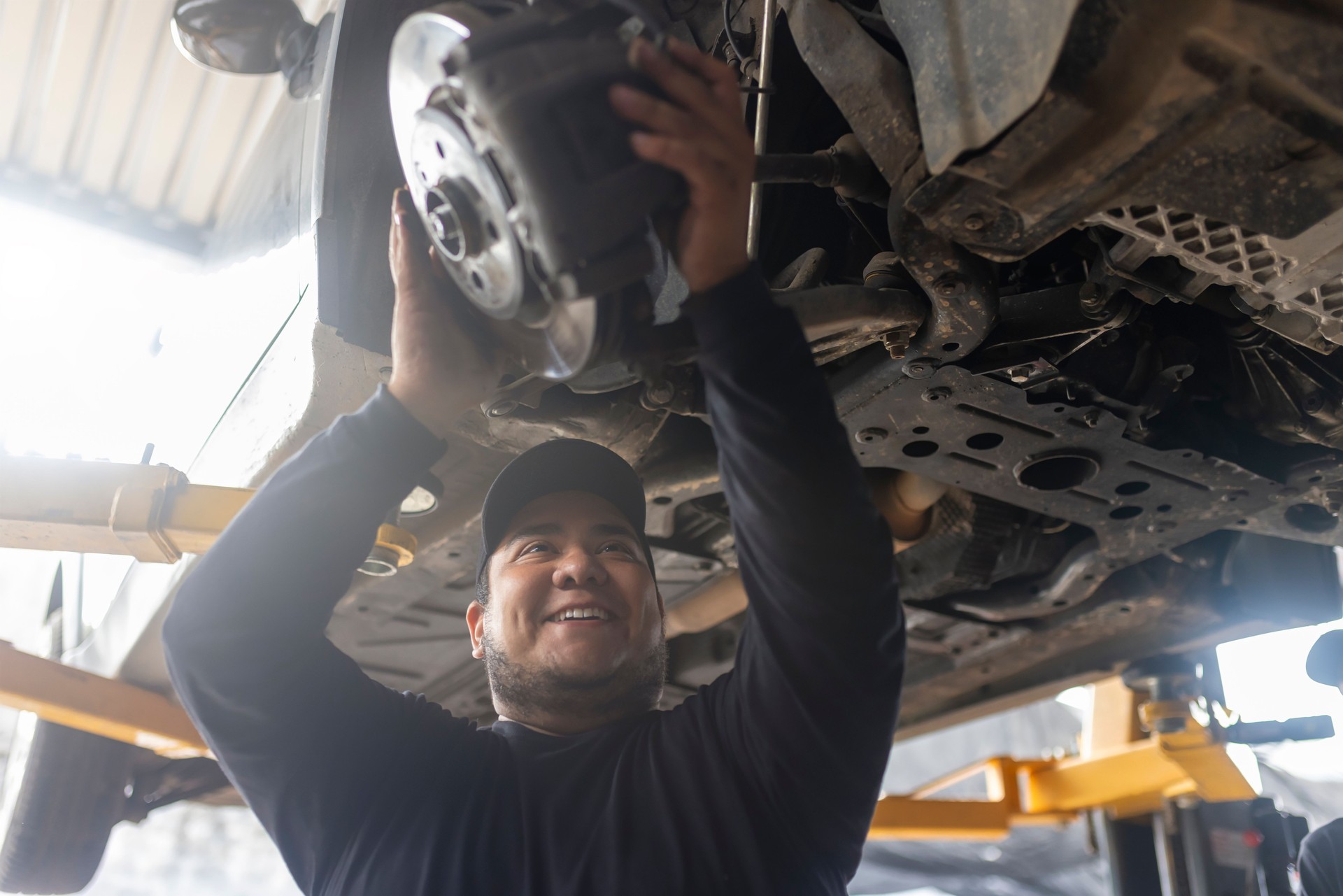 Portrait of a happy mechanic doing his job